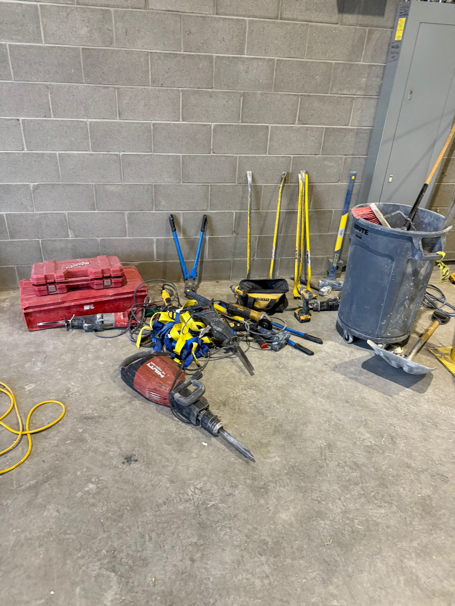 Concrete demolition tools including chipping hammers and breakers on site
